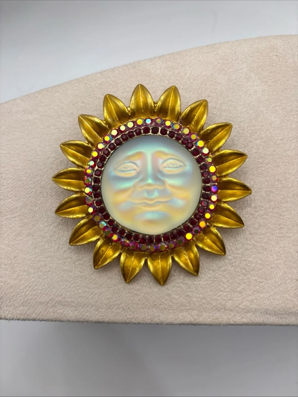 Iridescent Moon Face Sunburst Fashion Brooch with Ruby Colored Aurora Rhinestone
